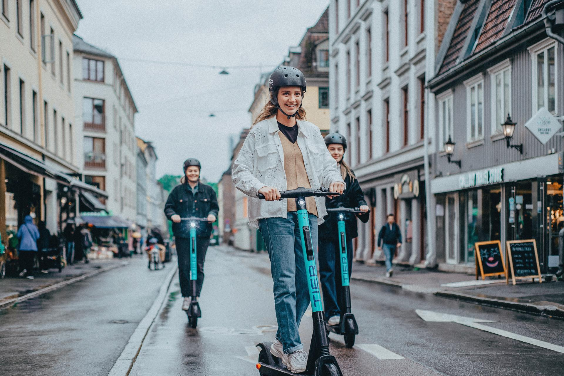 image of person riding a Tier e-scooter